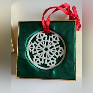 Elegant White Snowflake Ornament with Red Ribbon